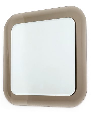 UNO SPECCHIO DA PARETE, 1979. Cristallo colorato molato, cristallo argentato....