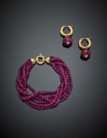 Demi-parure formata da bracciale ed orecchini: il bracciale di rubini...