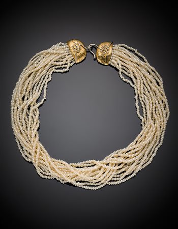 ANGELA PUTTINI - CAPRIChiusura in oro giallo e bianco a disegno floreale,...