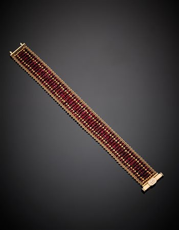 SUN DAYBracciale morbido a fascia in oro rosso e rubini a boules sfaccettate,...