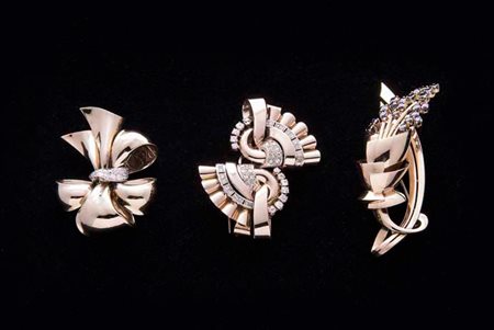 Spilla a doppia clips in oro rosa e oro bianco con brillanti del peso...