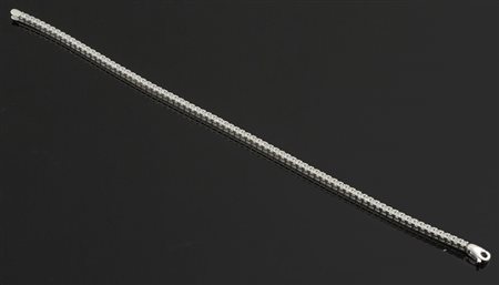 Bracciale "tennis" in oro bianco e zirconi. gr. 9,4.