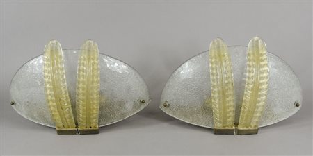 Coppia di appliques in vetro di Murano con foglie dorate applicate. Larg. Cm....