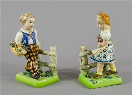 Preciosa: lotto di 2 statuine in ceramica policroma. H. cm. 19. (lieve...