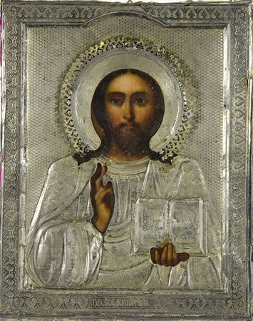 Icona dipinta su tavola raffigurante Cristo pantocratore con riza in argento....
