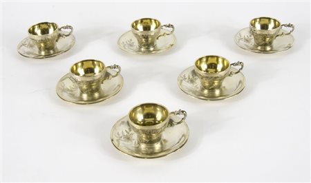 Lotto di 6 tazzine in argento con piattini, interno dorato. Gr. 255.