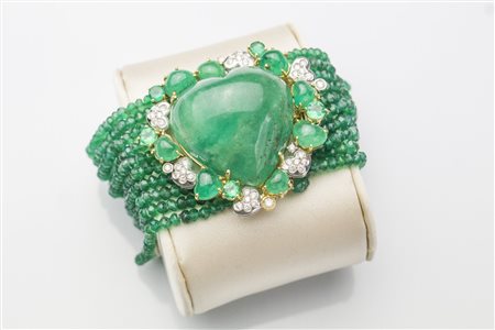 Bracciale in oro con smeraldi e diamanti . . . Bracciale in oro giallo e...