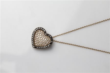 Ciondolo a cuore in oro e diamanti. . . Ciondolo a cuore in oro rosa con...