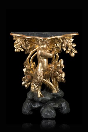 Consolle con piano a finto marmo di forma sagomata sorretto da fauno e alberi...