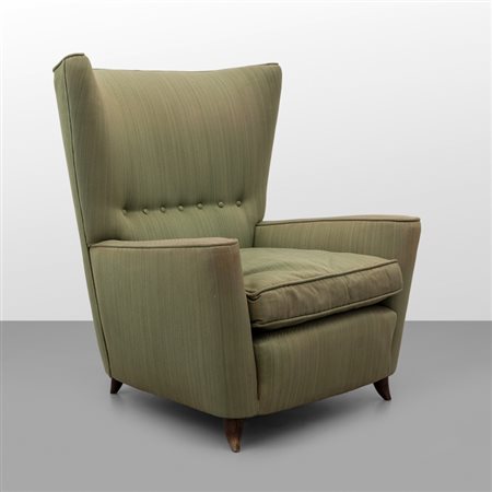 PAOLO BUFFA Una poltrona, anni '50. Struttura in legno, imbottitura rivestita...