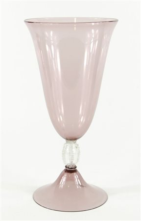 Grande vaso in vetro ambrato a tromba con base rotonda. Murano. H. cm. 37.