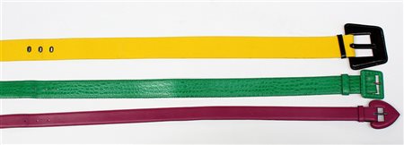 YVES SAINT LAURENT Lotto di tre cinture di materiali, forme, dimensioni e...