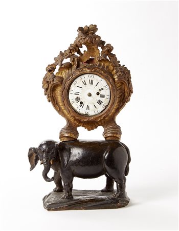 ANONIMOOrologio da carrozza in ottone con tracce di lacca, inserito in una...