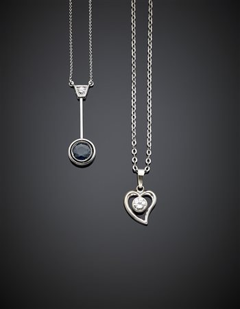 Due catenine con pendenti in oro bianco, una con zaffiro e diamante, con...