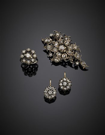 Demi-parure composta da broche, anello e orecchini in oro e argento rifinito...