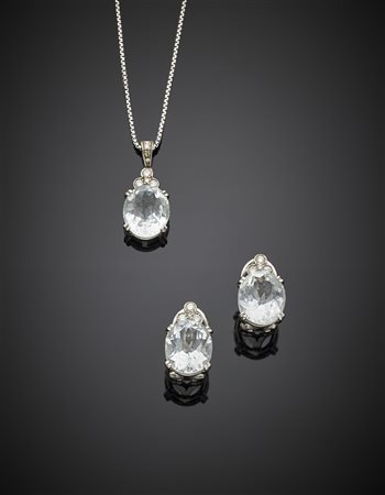 Demi-parure composta da orecchini a lobo e pendente con catenina in oro...