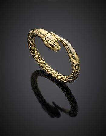 CHIMENTOBracciale rigido in oro giallo a guisa di serpente con rubini...
