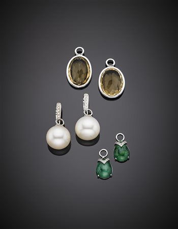 Orecchini pendenti in oro bianco con a lobo incastonati dei diamanti rotondi,...