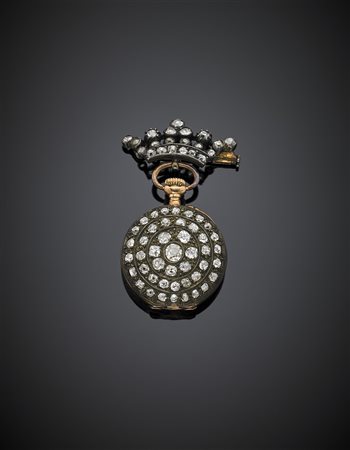 Broche in oro giallo e argento a guisa di corona con orologio pendente tutto...