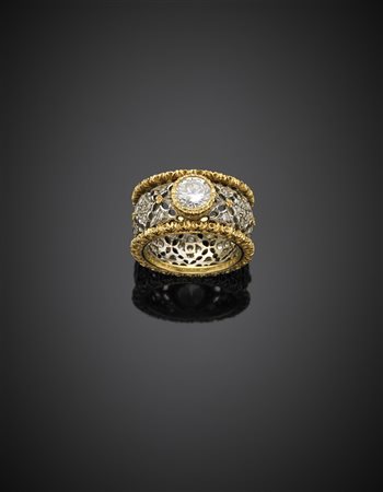 AUTIEROAnello in oro bianco e giallo in stile Buccellati, rifinito con...