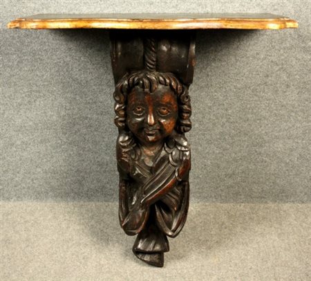 Firmato. Esemplare: 1 di 20. Mensola formata da un antico fregio in legno...