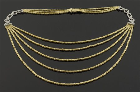 Collana a 3 fili in oro giallo intervallata da elementi in oro bianco con...