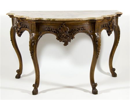 Grande consolle in legno riccamente scolpita a volute floreali, piano...