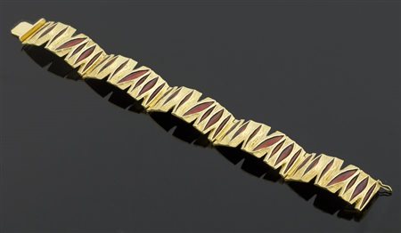 Bracciale semirigido in oro giallo e smalti rossi. Firmato Ottaviani. Gr. 49,8.