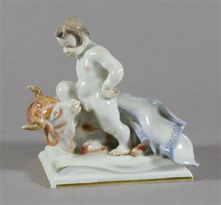 Meissen: scultura in porcellana policroma raffigurante bambino con toro. XX...