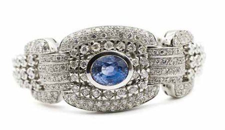 Bracciale in oro bianco, gr. 57,2, con zaffiro di ct. 3,5 ca. e diamanti...