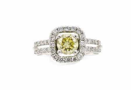 Anello in oro bianco, gr. 4,5, con brillante intensive yellow fancy ct. 0,70...