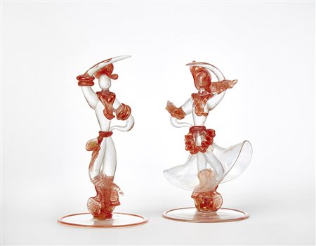 Seguso "Coppia danzante"Due sculture in vetro incolore fortemente iridato con...