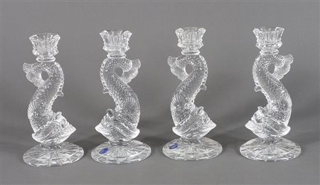 Lotto di 4 candelieri in cristallo a forma di delfini. H. cm. 21.