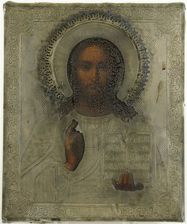 Icona dipinta su tavola raffigurante Cristo, con riza in argento. Cm. 27x22.