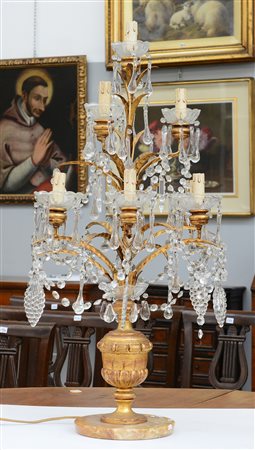 Girandole a dieci luci in legno e metallo dorati a forma di cespo di foglie...