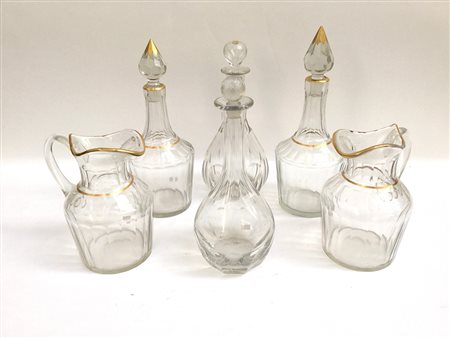 Lotto composto da due brocche e due bottiglie con tappo in cristallo molato...