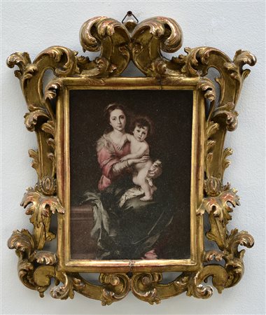 Cornice in legno intagliato e dorato contenente una stampa (luce cm 21x15)