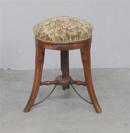 Sgabello tondo in noce con gambe a sciabola e seduta regolabile rivestita in...