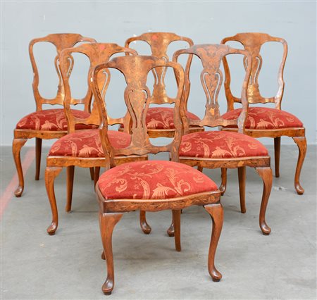 Gruppo di sei sedie con schienale a giorno sagomato e lastronate in radica,...