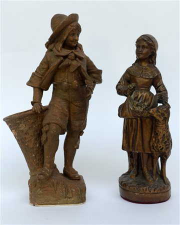 Lotto composto da due sculture in terracotta patinata a finto bronzo...