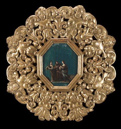 Cornice del secolo XVII in legno intagliato, traforato e dorato a figure...