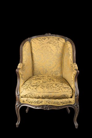 Bergère in noce con montanti e schienale sagomati e intagliati a motivi...