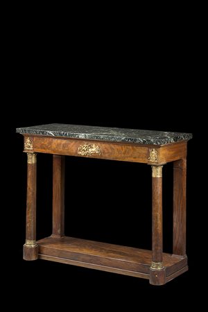 Tavolo da parete lastronato in mogano ad un cassetto sottopiano centrato da...