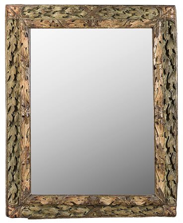 Cornice in legno laccato, dorato e intagliato a foglie e volute. Secolo XVII...