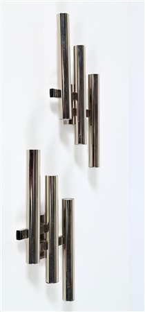 STILNOVO Coppia di applique in metallo cromato, anni 60. -. Cm 19,00 x 37,00...