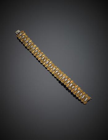 ATTILIO BUZZETTI ROMABracciale in oro giallo e bianco lucido e zigrinato...