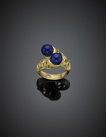 Anello in oro giallo a contrarié con due boules blu, g 9,26 misura...