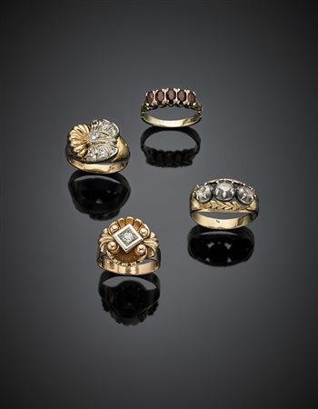 Quattro anelli di varia foggia con diamanti, granati e paste vitree,...