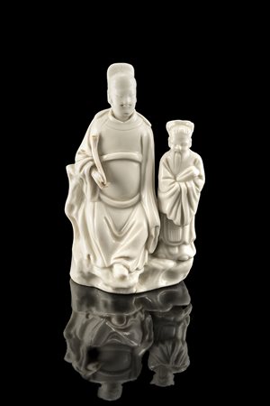 Gruppo in porcellana blanc-de-Chine raffigurante un ufficiale mandarino su...