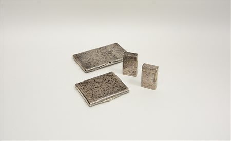 Lotto composto da due porta sigarette e due accendini, in argento....